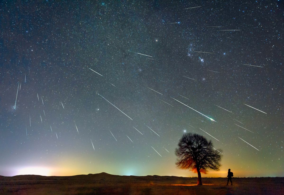 The Geminid meteor shower on December 13, 2020 was photographed in the Kubuqi Desert of Inner Mongolia, China, on a very cold night of minus 20 degrees