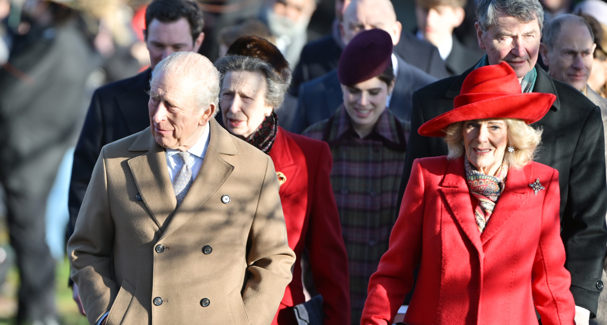 King Charles walking with Queen Camilla on Christmas Day with Princess Eugenie and Princess Anne walking behind