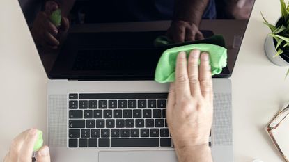 Laptop screen being cleaned