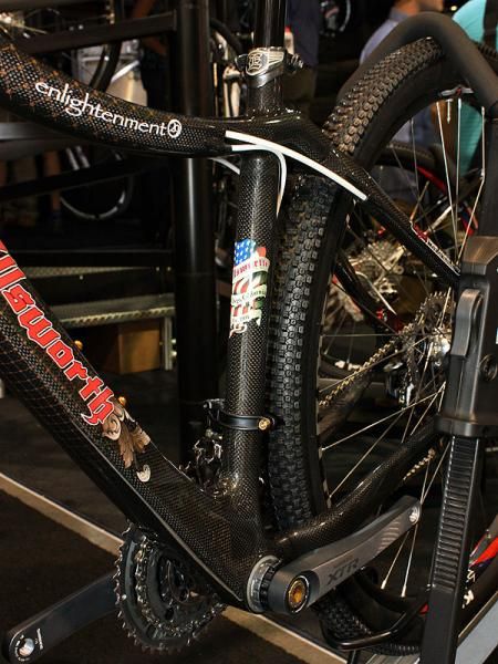 Cables are fully internally routed on the Enlightenment - including the rear brake so you'll have to disconnect the fittings and rebleed the system to feed a hydraulic hose through.