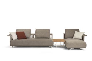 Grey outdoors sofa with woven back