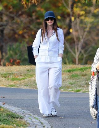 Anne Hathaway enjoys some fresh air as she goes for a solo stroll through Central Park in NYC after election day wearing adidas sambas