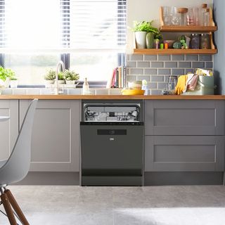 Beko washing machine built in to grey kitchen cabinetry