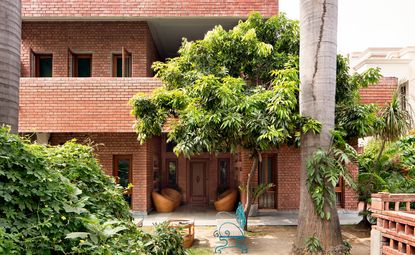 The façade and front garden of the brick row house that architect Noor Dasmesh Singh has restored and renovated