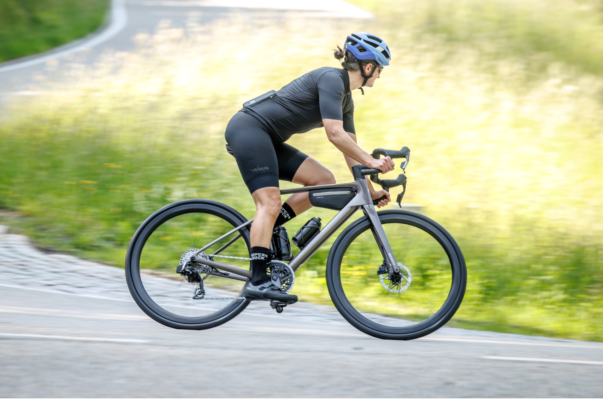 A rider decends on the Scott Addict 10 road bike