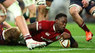 Maro Itoje reaches for the try line in a Lions fixture against Queensland Reds.