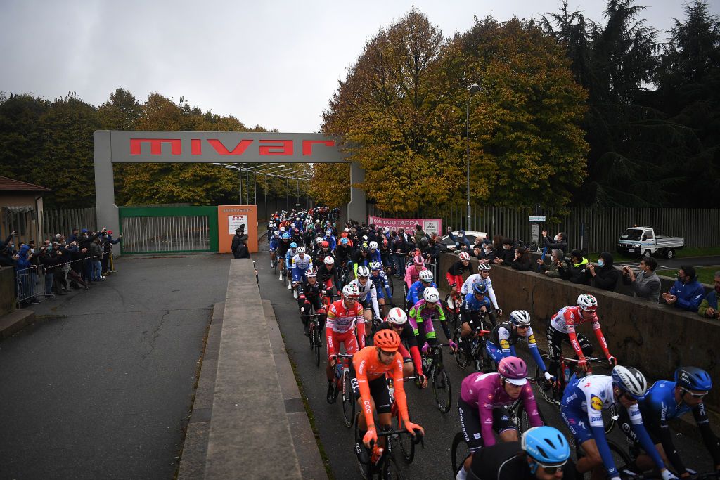 ASTI ITALY OCTOBER 23 Start Wilco Kelderman of The Netherlands and Team Sunweb Pink Leader Jersey Arnaud Demare of France and Groupama FDJ Purple Points Jersey Ruben Guerreiro of Portugal and Team EF Pro Cycling Blue Mountain Jersey Jai Hindley of Australia and Team Sunweb White Best Young Rider Jersey Abbiategrasso Village Mivar Factory Peloton during the 103rd Giro dItalia 2020 Stage 19 a 1245km stage from Abbiategrasso to Asti Stage shortened due to heavy rain girodiitalia Giro on October 23 2020 in Asti Italy Photo by Tim de WaeleGetty Images