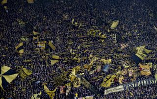 Borussia Dortmund's famous yellow wall of fans in a game against Freiburg in February 2024.