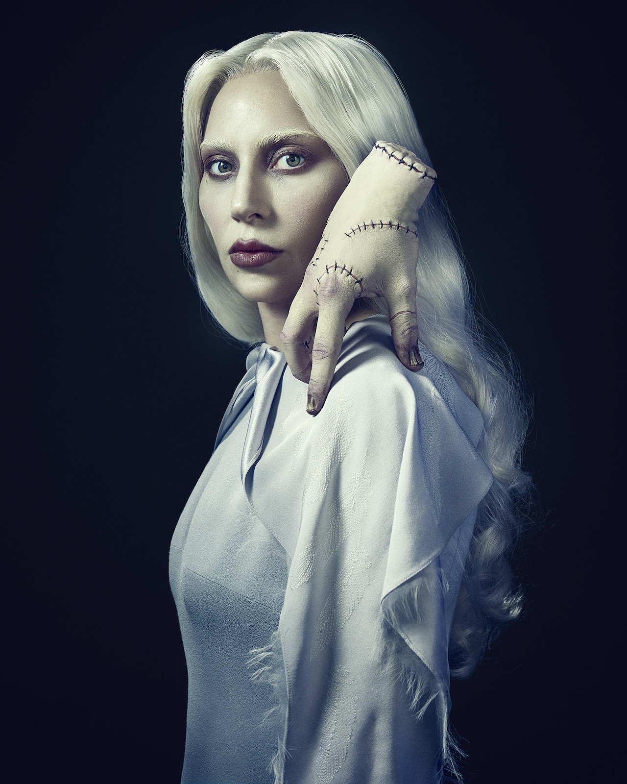Portrait shot of Lady Gaga&#039;s Rosaline Rotwood and Thing in Wednesday Season 2