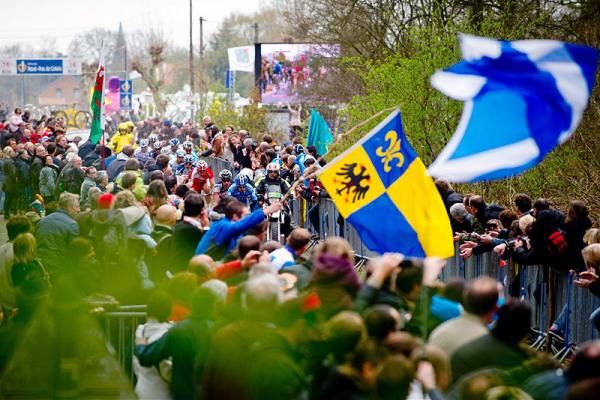 Spectators try to catch a glimpse of their favourite riders during the 2012 edition of Paris-Roubaix.
