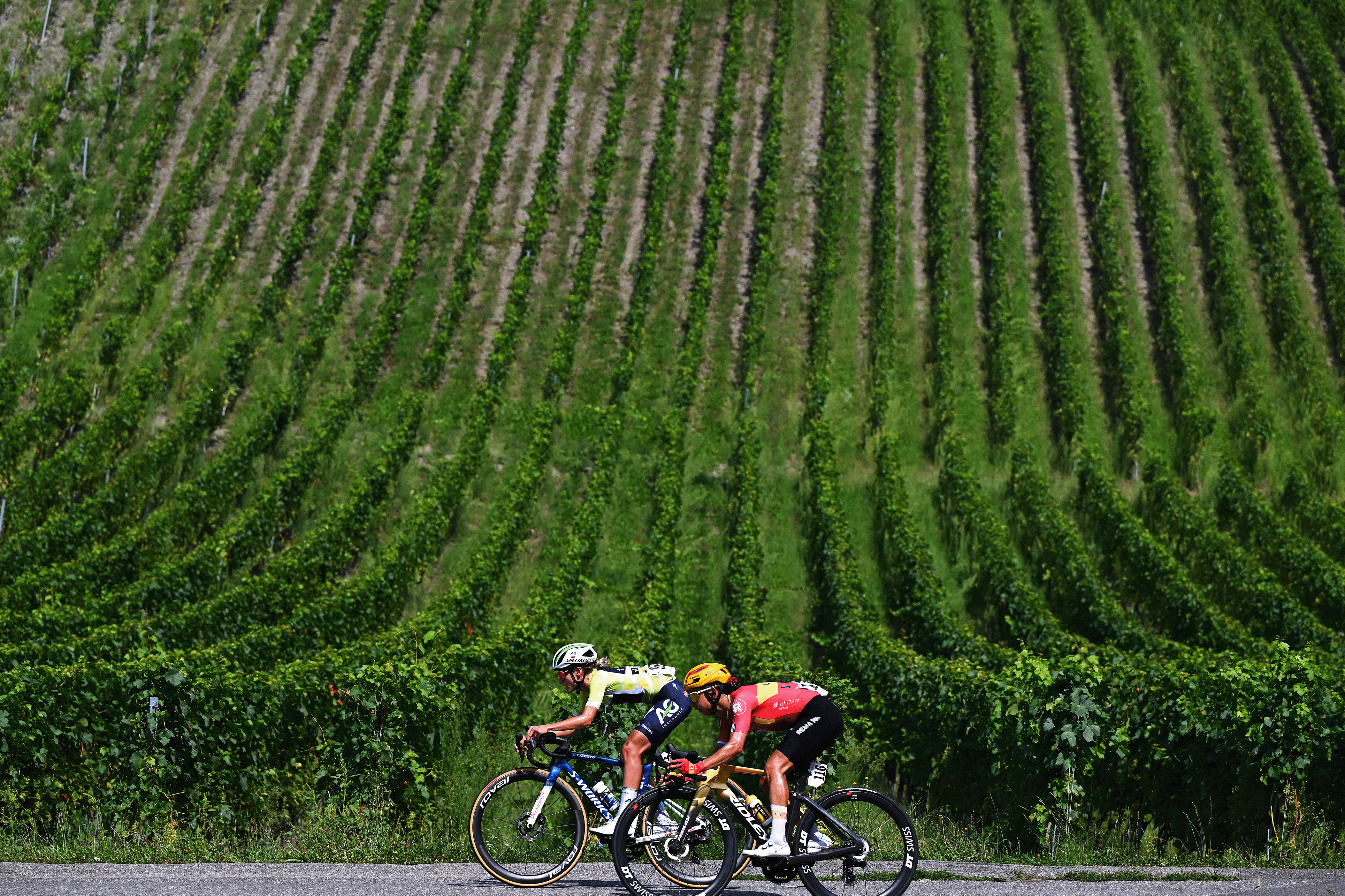 AIGLE, SWITZERLAND - AUGUST 17: (L-R) Urska Zigart of Slovenia and Team AG Insurance - Soudal - Yellow Leader Jersey and Anouska Koster of Netherlands and Team Uno-X Mobility compete during the 4th Tour de Romandie Feminin 2025, Stage 3 a 122.1km stage from Aigle to Aigle / #UCIWWT / on August 17, 2025 in Aigle, Switzerland. (Photo by Dario Belingheri/Getty Images)