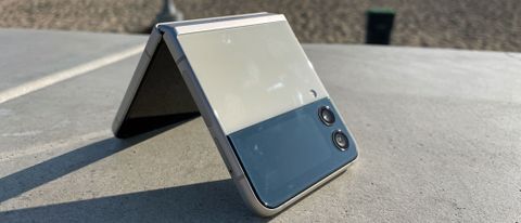 A Samsung Galaxy Z Flip 3 half folded, outside