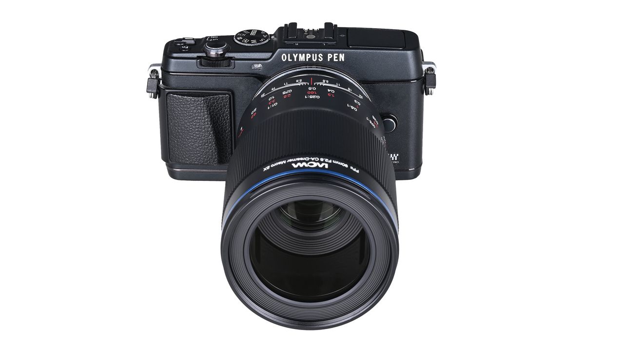 A black Laowa digital camera lens attached to an Olympus camera.