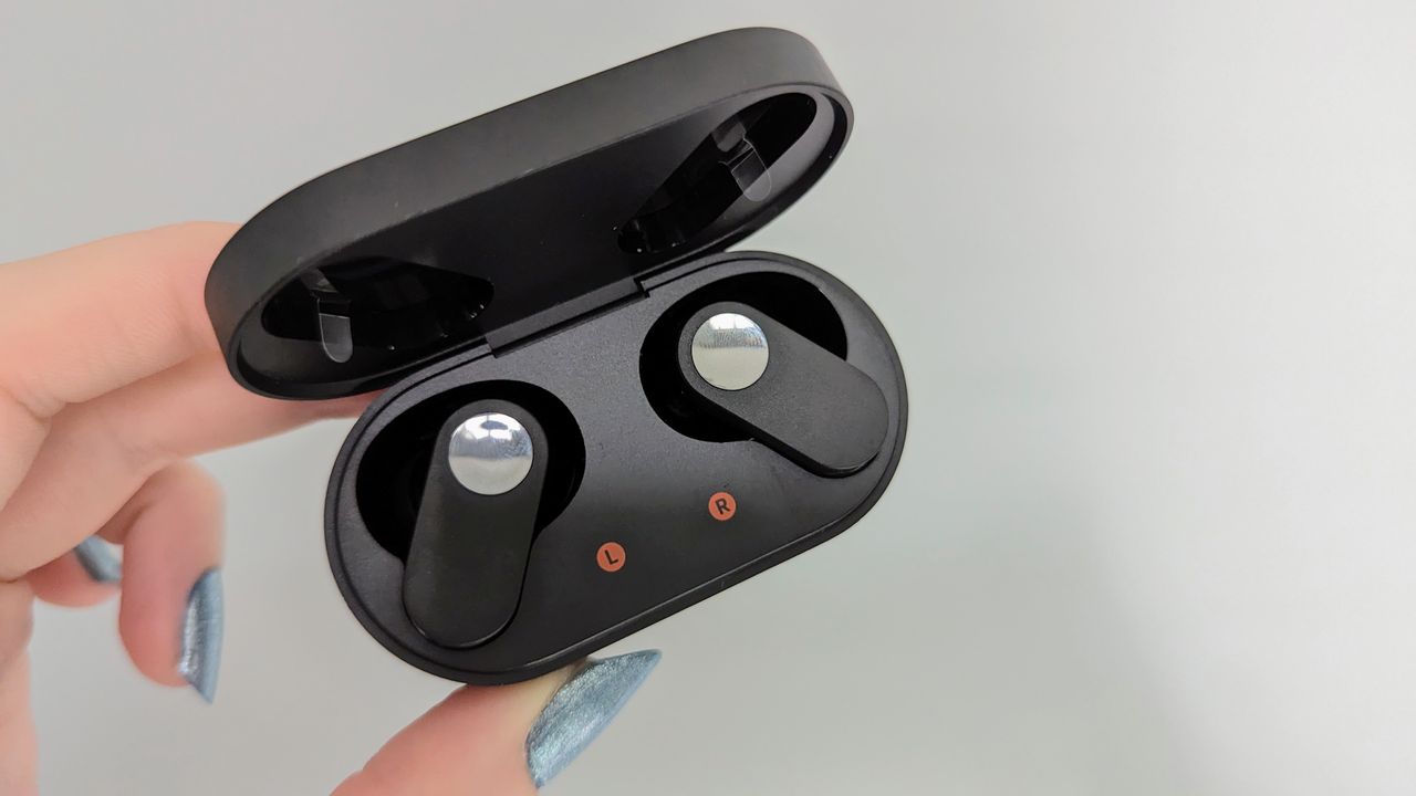 OnePlus Nord Buds review: true wireless earbud case held in hand with blue glitter nails