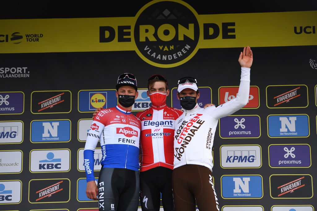 OUDENAARDE BELGIUM APRIL 04 Podium Mathieu Van Der Poel of Netherlands and Team AlpecinFenix Kasper Asgreen of Denmark and Team Deceuninck QuickStep Greg Van Avermaet of Belgium and Team AG2R Citren Team Celebration during the 105th Ronde van Vlaanderen Tour of Flanders 2021 Mens Elite a 2515km race from Antwerp to Oudenaarde Mask Covid Safety Measures RVV21 rondevanvlaanderen tourofflanders on April 04 2021 in Oudenaarde Belgium Photo by Tim de WaeleGetty Images