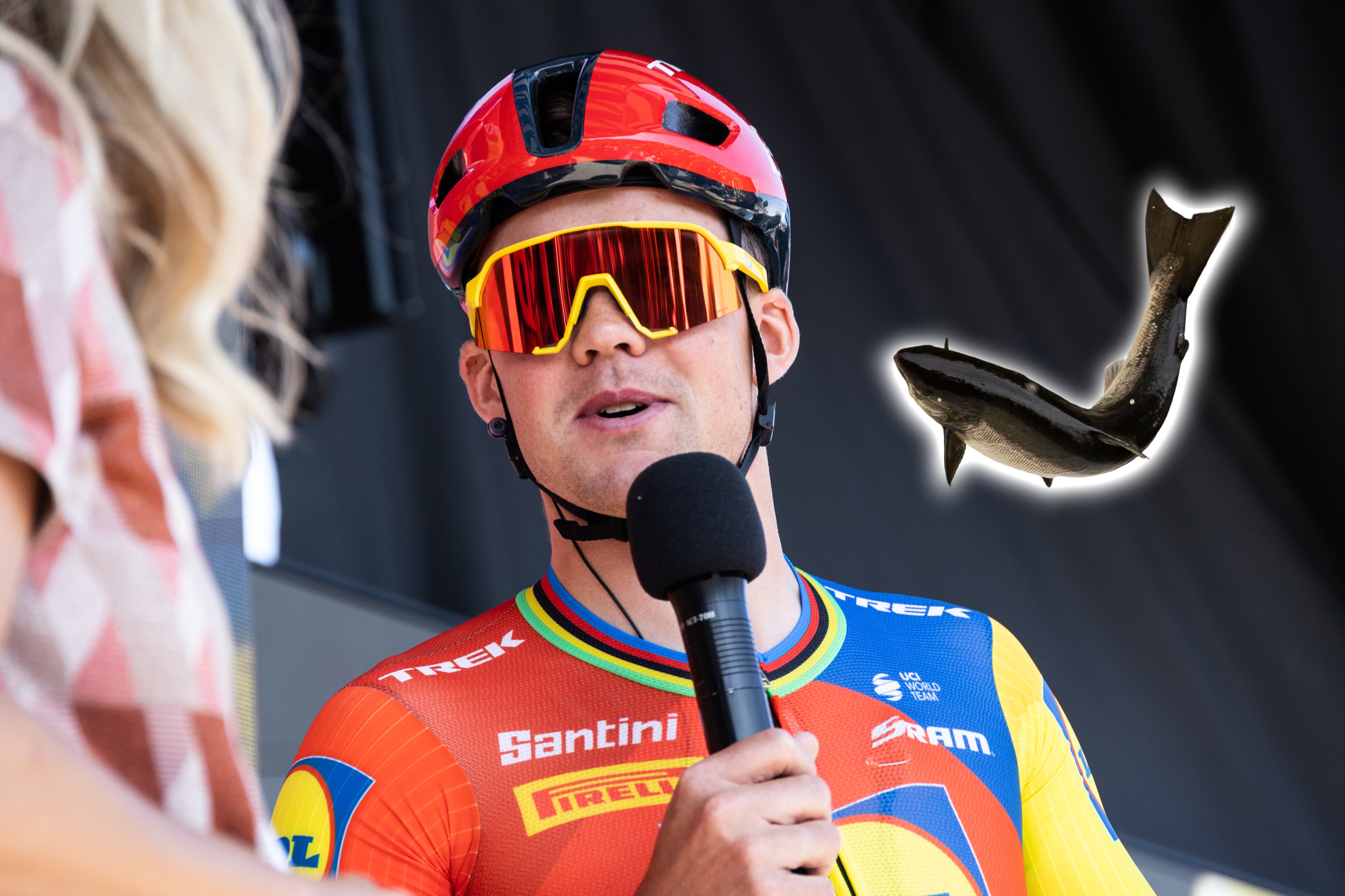 Mads Pedersen speaking into a microphone with a picture of a salmon embedded next to him