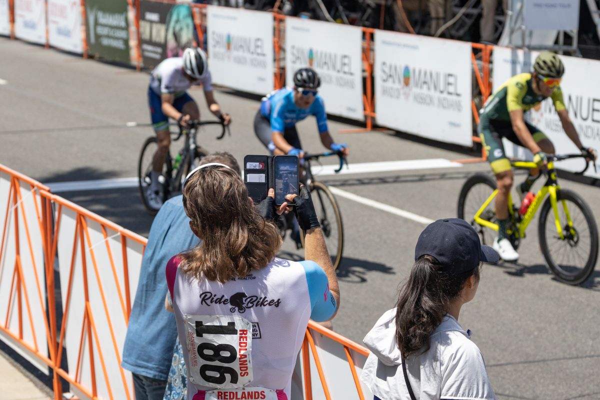 Rex Roberts (Ride Bikes Bro) helps some spectators with a photograph.