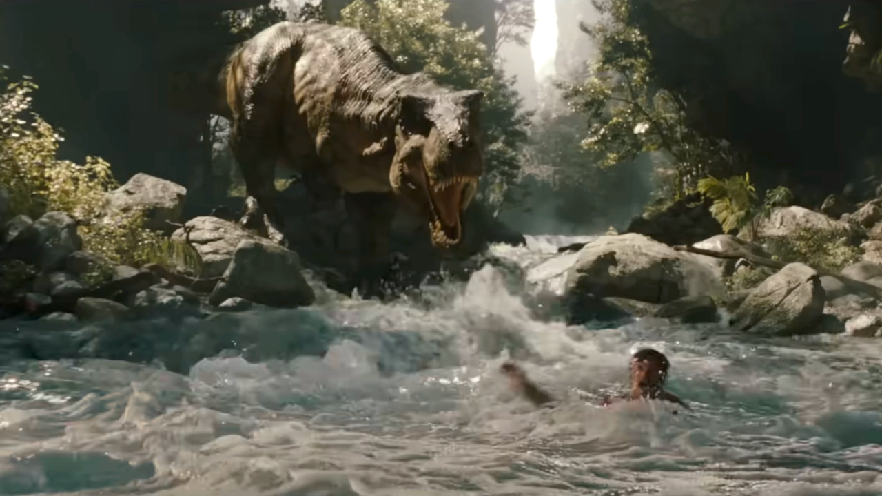 A T rex roars in front of some roaring rapids in Jurassic World Rebirth.