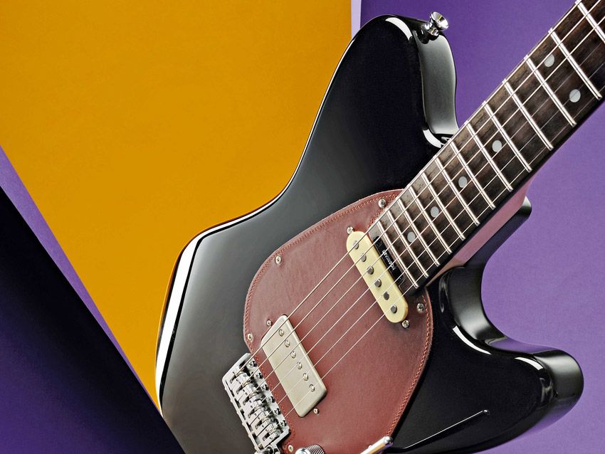 Everybody needs a hand-tooled leather scratchplate in their lives