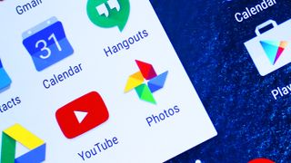 A close up of the Google Photos app logo on a smartphone