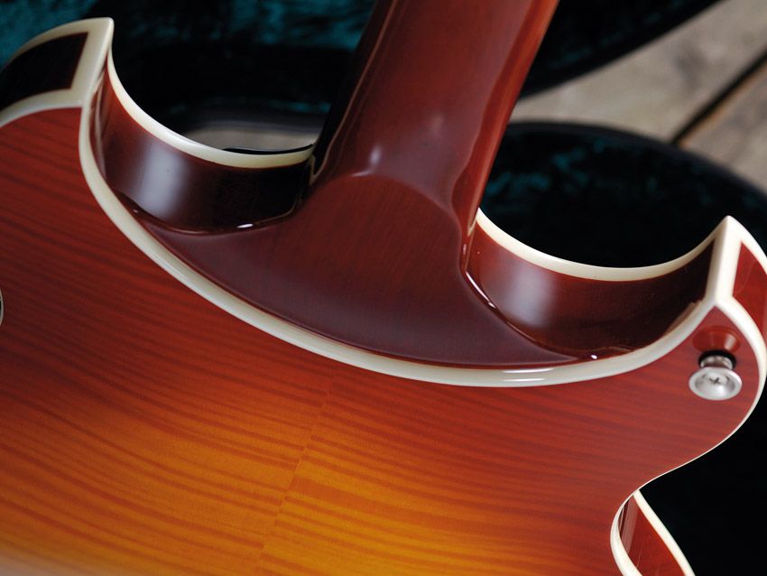 The heel is in fact an extension of the body's mahogany centre section.