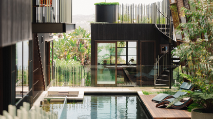 a beautiful outdoor swimming pool in a tropical setting 