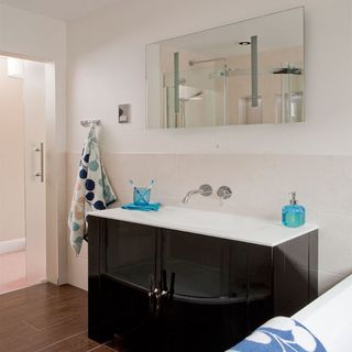 bathroom with vanity unit and shower
