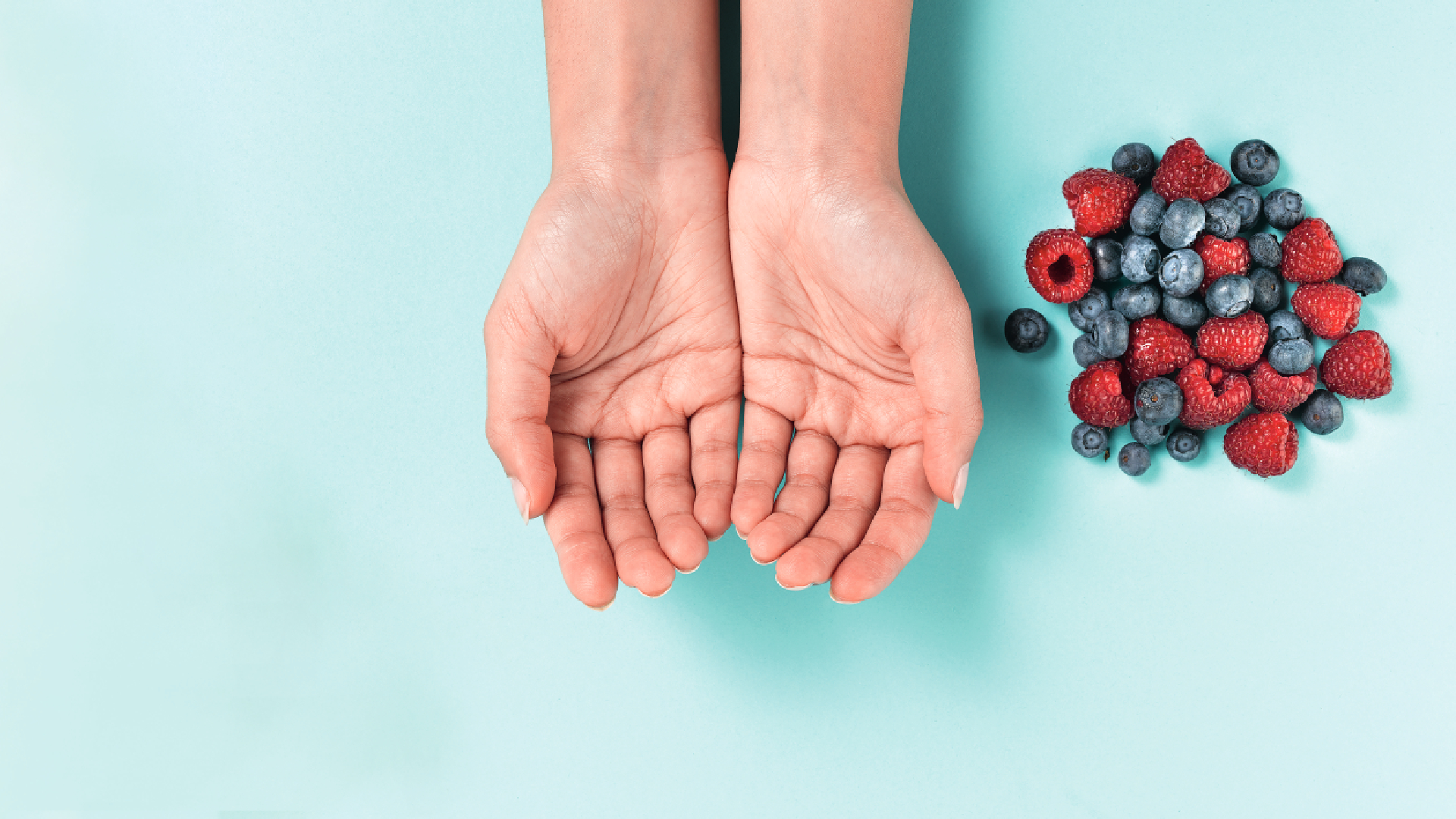 hands next to portion of fruit