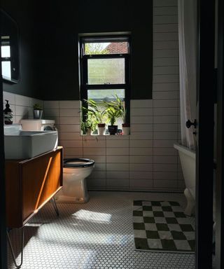 Small bathroom with checkerboard rug