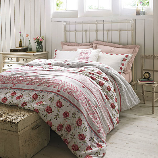 bedroom with wooden flooring and double bed