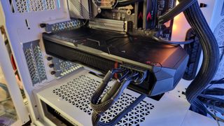 AMD Radeon RX 7900 XTX inside a gaming PC, connected to a motherboard