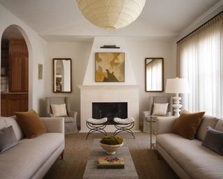 neutral living room with beige sofas