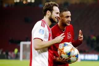 Daley Blind and Hakim Ziyech pose with match balls after each scoring hat-tricks for Ajax in an 8-0 win over De Graafschap in December 2018.