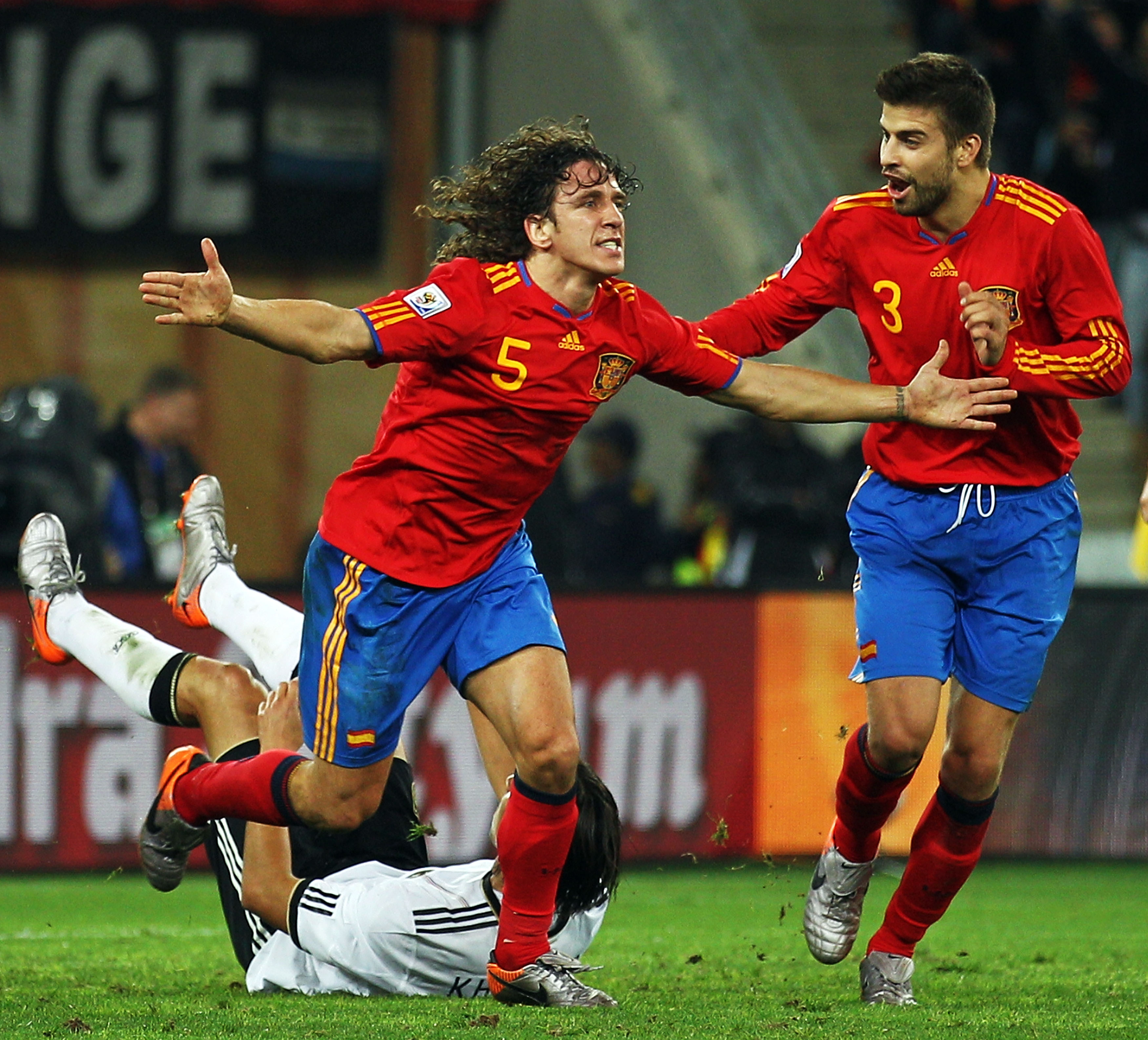 Carles Puyol (left) celebrates with Gerard Pique after scoring for Spain against Germany in the semi-finals of the 2010 World Cup.