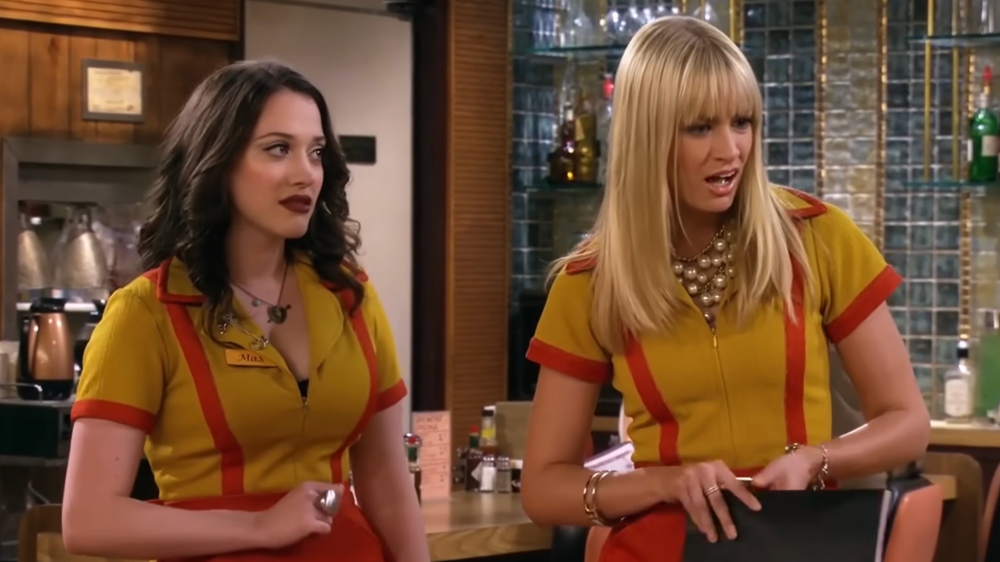 Max and Caroline on Two Broke Girls in the diner. 
