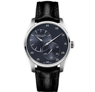 The long hand points to minutes; the left dial is hours; and the right dial is seconds. A simple, stunning watch