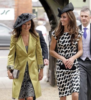 Pippa and Kate Middleton attend a wedding on June 11, 2011