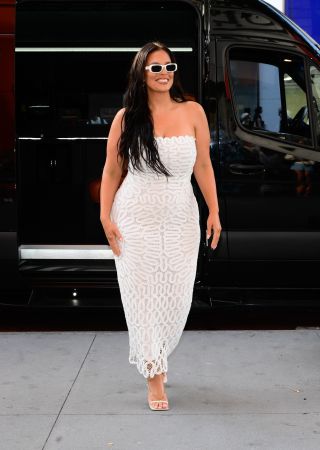 Asshley Graham wearing a semi-sheer white Simkhai sundress in New York City July 2024