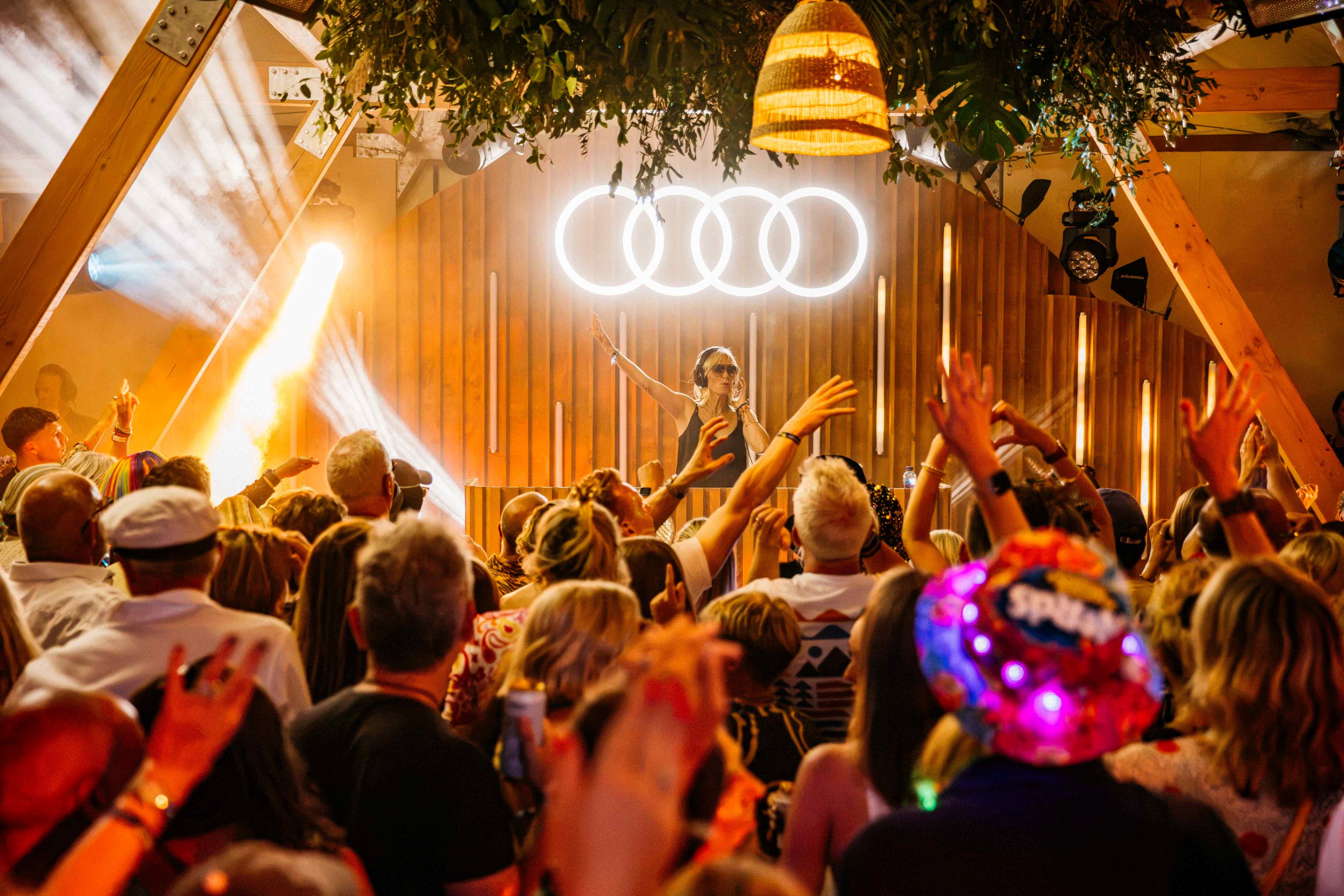 Jo Whiley DJs in front of a frantic crowd at Audi's stage at Wilderness