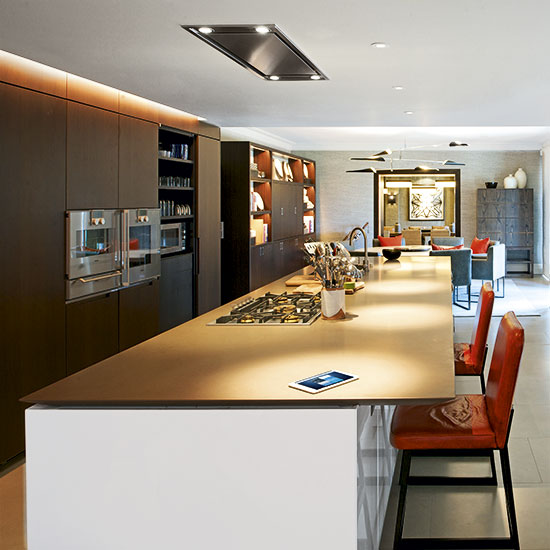 Kitchen with brown cabinets and white walls