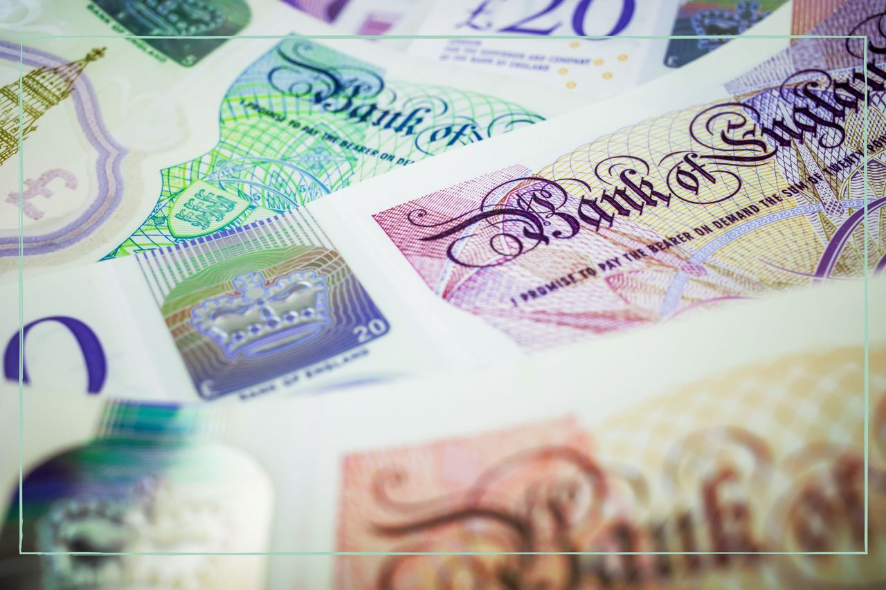 A close up of a pile of British bank notes