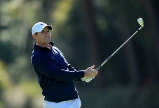 McIlroy hits an iron shot