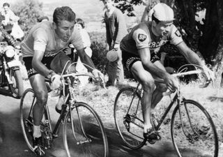 Le Franais Jacques Anquetil G maillot jaune de leader est au coude coude avec son compatriote Raymond Poulidor dans lascension du Puy de Dme le 12 juillet 1964 lors de la 20me tape du Tour de France menant les coureurs de Brive ClermontFerrand A larrive Poulidor 3me reprendra 42 secondes Anquetil insuffisant cependant pour empcher le Normand de remporter Paris son 5me Tour de FranceFrench cyclist Jacques Anquetil L wearing the yellow jersey of leader rides uphill in the Puy de Dme next to his compatriot Raymond Poulidor during the 20th stage of the Tour de France between Brive and ClermontFerrand Poulidor finished 3rd of the stage 42 seconds in front of Anquetil but not enough to stop Anquetil from winning his record fifth Tour de France Photo by STAFF AFP Photo by STAFFAFP via Getty Images