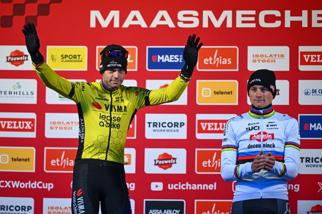 Wout van Aert takes the position on the podium for second-place finish next to winner Mathieu van der Poel at the World Cup event in Maasmechelen