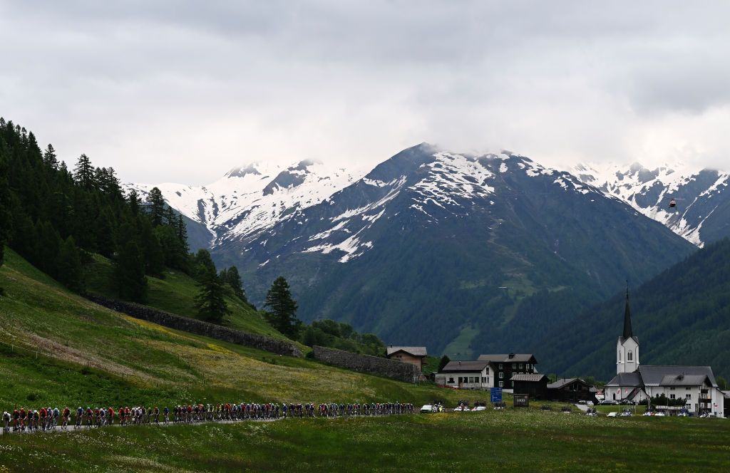 BLATTEN SWITZERLAND JUNE 14 A general view of the peloton passing through a landscape during the 87th Tour de Suisse 2024 Stage 6 a 425km stage from Ulrichen to Blatten 1330m UCIWT on June 14 2024 in Blatten Switzerland Photo by Tim de WaeleGetty Images