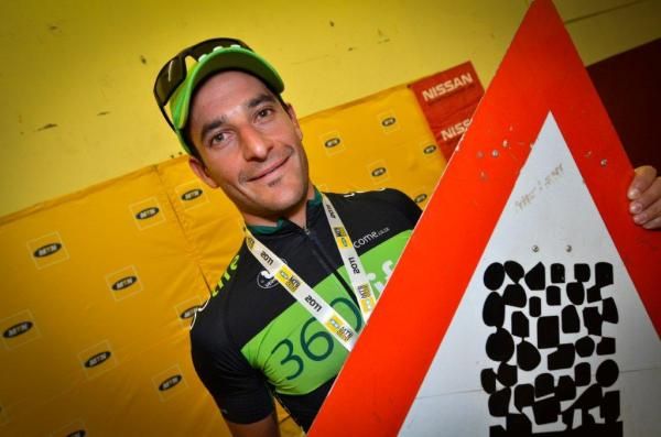 Kevin Evans holds his trophy.