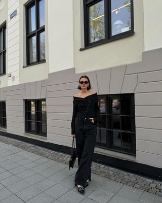 @maryljean wearing a black bardot top, jeans and mary-janes