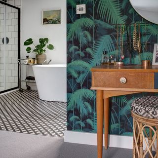 bathroom with palm designed wallpaper wooden drawers and grey designed floor
