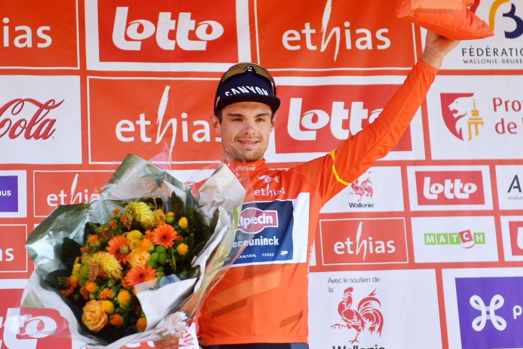 HERVE BELGIUM JULY 24 Robert Stannard of Australia and Team AlpecinDeceuninck celebrates winning the Orange Leader Jersey on the podium ceremony after the 43rd Ethias Tour de Wallonie 2022 Stage 2 a 1768km stage from Verviers to Herve 274m ethiastourdewallonie22 on July 24 2022 in Herve Belgium Photo by Luc ClaessenGetty Images