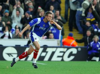 Matt Taylor celebrates after scoring a volley from near the halfway line for Portsmouth against Everton, 2006